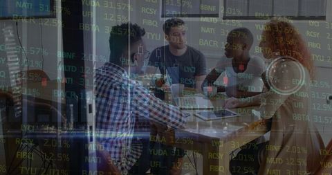 Young Team Discussing Financial Data in Modern Meeting Room