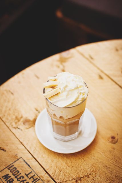 Iced Coffee with Whipped Cream on Rustic Wooden Table - Download Free Stock Photos Pikwizard.com
