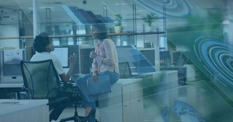 Colleagues Collaborating with Augmented Reality in Modern Office