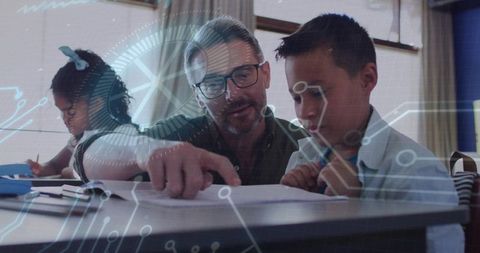 Male tutor pointing to workbook guiding students in classroom learning with tech overlay