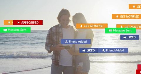 Couple on Beach with Social Media Notifications at Sunset