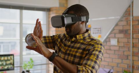 African American Male Using Virtual Reality in Office Environment