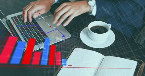 Businessman typing on laptop with coffee and notebook, financial charts overlay