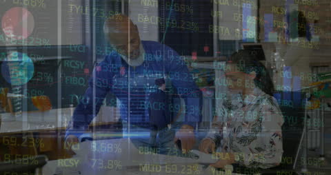 Business Executives Analyzing Financial Data with Modern Technology