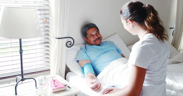 Nurse Caring for Elderly Man at Home in Bed - Download Free Stock Images Pikwizard.com