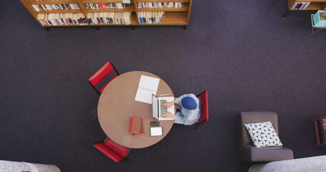 Student Studying in Library with Laptop and Books - Download Free Stock Images Pikwizard.com