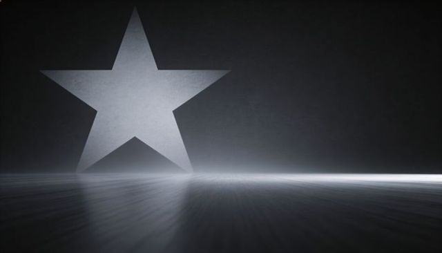 Monochrome star projection reflecting on glossy floor with hazy light beam, minimalist