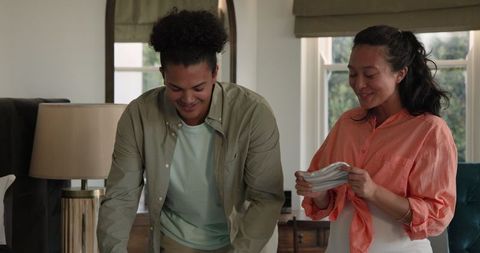 Expectant Couple Enjoying Pregnancy Together in Cozy Home