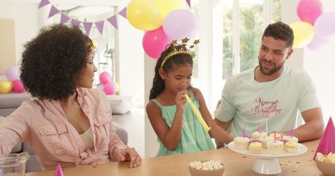 Joyful Birthday Celebration at Home with Family and Cupcakes