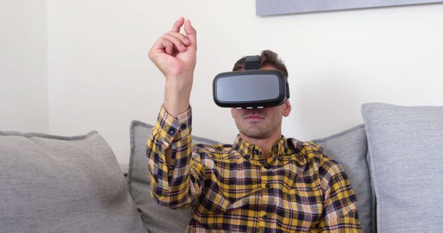 Man Gaming with Virtual Reality Headset on Sofa - Download Free Stock Images Pikwizard.com