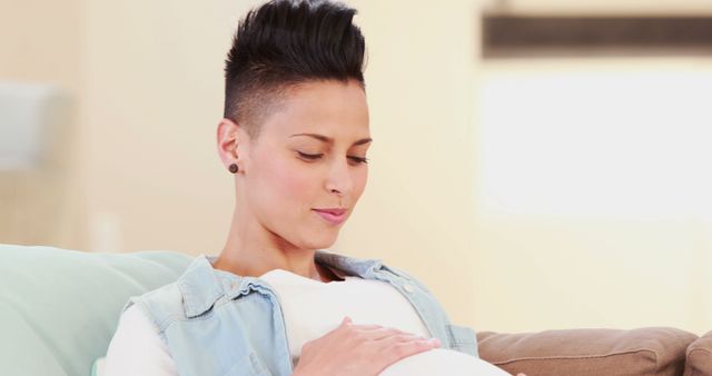 Pregnant woman contemplating while touching stomach - Download Free Stock Images Pikwizard.com