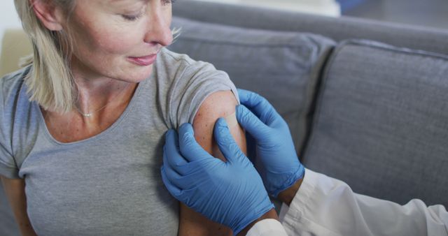 Healthcare Professional Administering Vaccine to Woman - Download Free Stock Images Pikwizard.com