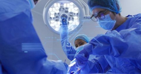 Surgical team performing operation with smart digital overlays and led operating light