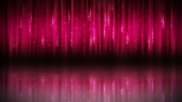 This video shows glittering pink stage curtains adorned with sparkling light effects. The reflective surface at the bottom creates a sense of depth and elegance. Perfect for use in theatrical presentations, advertisements for stage events, glamour photoshoots, or as a background for party invitations.