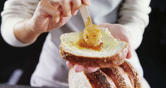 Spreading Honey on Slice of Whole Grain Bread - Download Free Stock Images Pikwizard.com