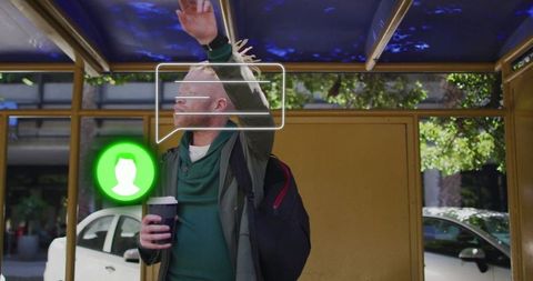 Casual man waiting at bus stop with chat icon overlay