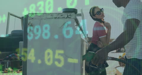 Creative Composite of Couple at Gas Station with Stock Market Overlay