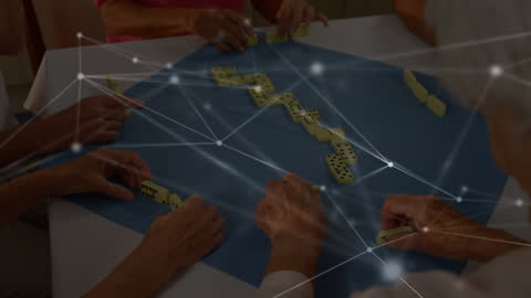 Elderly Hands Playing Dominoes Illustrating Connectivity Concept