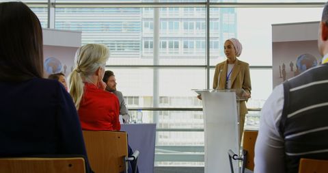 Confident Businesswoman in Hijab Presenting at Conference
