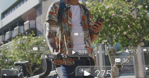 Urban cyclist holding smartphone and steadying bike on sunny sidewalk with social notifications