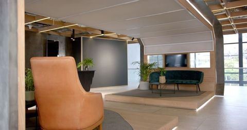 Modern Office Lounge with Leather Chair and Green Sofa - Download Free Stock Images Pikwizard.com