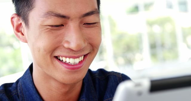 Happy man using digital tablet indoors - Download Free Stock Images Pikwizard.com