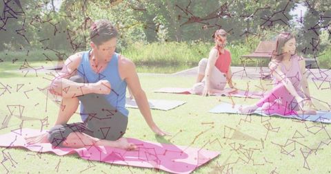 Group Yoga Class in Park for Relaxation and Wellness