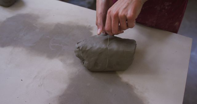 Potter Preparing Clay with Wire for Sculpting - Download Free Stock Images Pikwizard.com