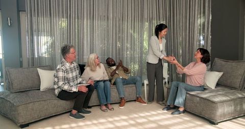 Diverse group therapy session with positive interaction