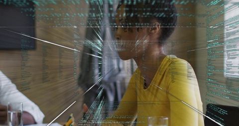 Leading woman guiding team meeting with holographic data overlay and digital analytics