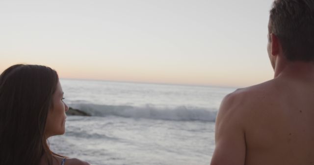 Couple Enjoying Serene Ocean View at Sunset - Download Free Stock Images Pikwizard.com