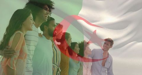 Diverse group celebrating unity against flag backdrop