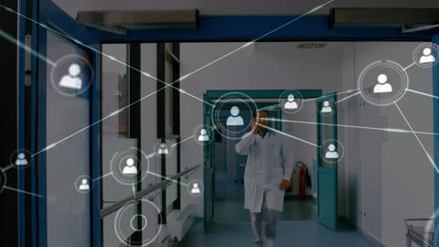 Doctor in Hospital Corridor Surrounded by Digital Network Graphics