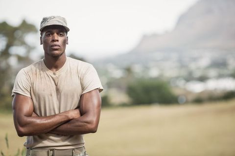 Determined african american soldier standing on outdoor training series