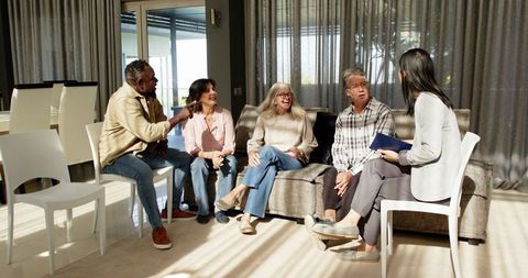 Diverse Group Therapy Session with Happy Individuals Sharing Together