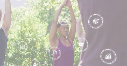 Outdoor yoga group stretching african american woman raising arms with wellness icons