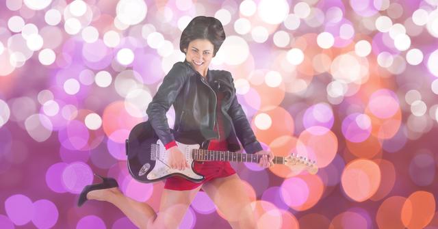 Woman jumping while playing electric guitar against a vibrant bokeh background. Ideal for music-related promotions, concert posters, event advertisements, album covers, and entertainment blogs.