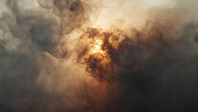 Abstract Smoke Swirls with Luminous Warm Glow
