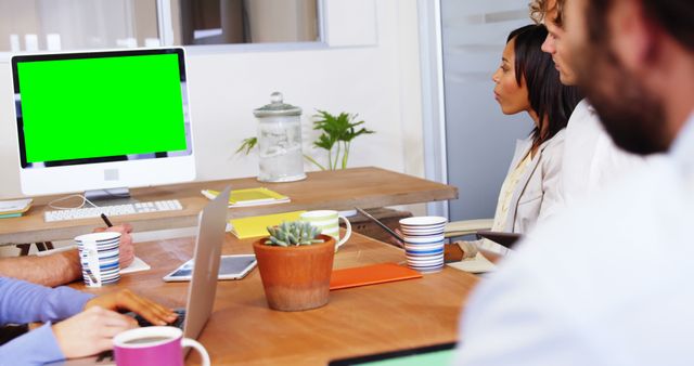 Team Meeting in Modern Office with Green Screen Monitor - Download Free Stock Images Pikwizard.com