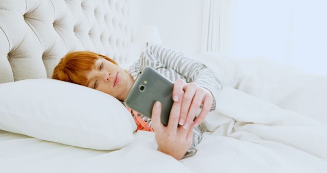 Woman Relaxing in Bed Using Smartphone in Morning - Download Free Stock Images Pikwizard.com
