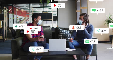 Engaged Pair Conversing with Overlay of Social Media Icons