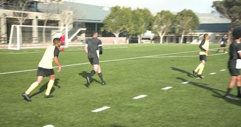 Soccer Team Gathering for Practice on Sunny Day
