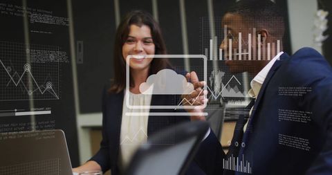 Collaborating colleagues analyzing digital data interface in modern office