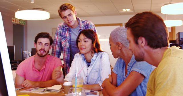 Diverse Group of Young Adults Collaborating in Office Setting - Download Free Stock Images Pikwizard.com