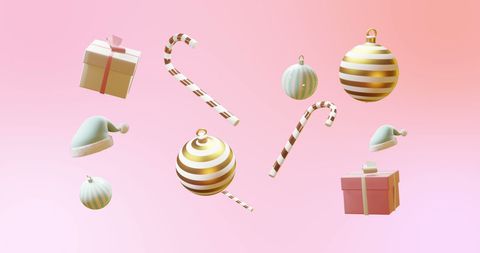Floating Christmas Decorations on Pink Background