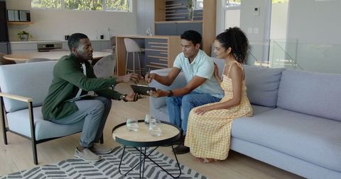 Real Estate Consultation with Professional in Modern Living Room Setting