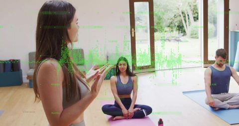 Yoga instructor guiding group on mats with sunlit garden view and green data overlay