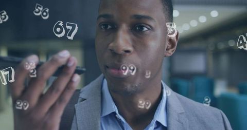Businessman speaking into smartphone with floating numeric data overlay in modern lobby