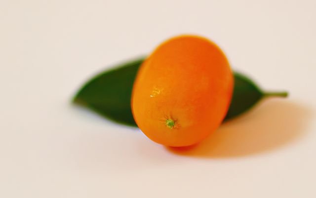 Close up of kumquat on white background created using generative ai technology. Fruits, nutrition and food concept, digitally generated image.