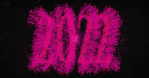 Vibrant pink fireworks celebrating new year 2022